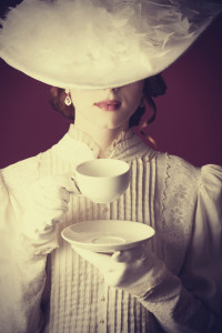 Beautiful redhead women with cup of tea